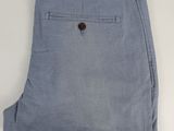 a close up of a pair of blue pants on a white surface