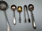 several spoons and spoon spoons are lined up on a table