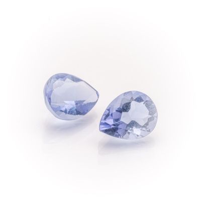 a pair of tanzanite gems on a white background