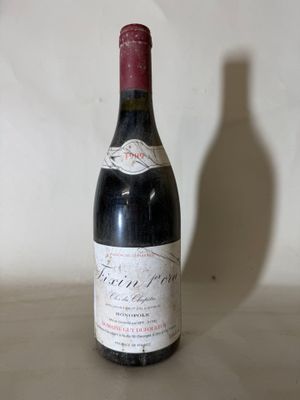 a bottle of wine that is sitting on a table