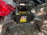 a picture of a construction vehicle that is parked on the side of the road