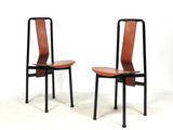 these are two chairs sitting next to each other on a white surface