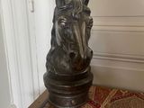 a statue of a horse on a table in a room