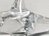 a glass sculpture of a horse with a heart on it