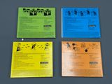 four different types of brochures are displayed on a gray surface