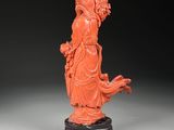 chinese carved coral figurine of a lady holding a flower