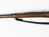 an old rifle with a wooden barrel on a white background