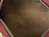 the inside of a handbag with a floral pattern on it
