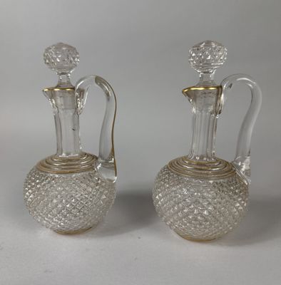 pair of antique cut glass decanters with gold trims
