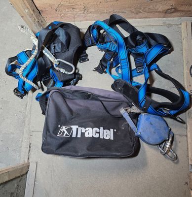 a black bag with blue straps and a black bag with a blue handle