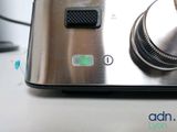 a close up of a silver and black blender on a counter