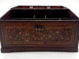 a wooden box with a lid that has a design on it
