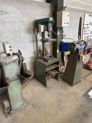 a machine that is sitting in a room with a lot of tools