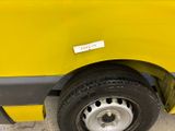 a yellow van with a sticker on the side of it