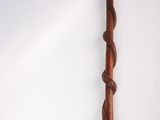 a wooden stick with a spiral design on it