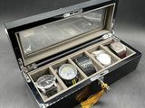 an image of a watch box with a watch inside of it