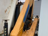 a picture of a truck with a crane attached to it ' s back