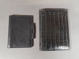 wallet and card case sitting on a table next to each other