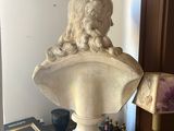 a statue of a lion sitting on top of a table