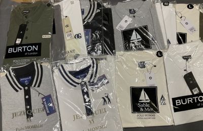 a lot of t - shirts that are wrapped in plastic