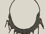 an image of a necklace made of metal with spikes on it