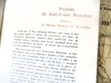 a close up of an open book with a map in the background