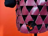 a purple and black leather jacket with metal studding on a mannequin mannequin mannequin mannequin mannequin mannequin manne
