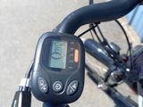 a close up of a bicycle ' s handlebar with a digital display