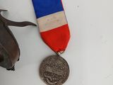 two medals and a bag on the table