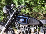 a black motorcycle parked in front of some trees