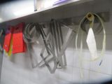 a picture of a kitchen with a bunch of utensils hanging on the wall