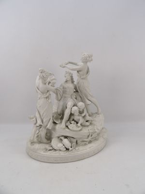 statue représentant un groupe de personnes sur un socle, accompagnées d'un chien