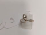 a ring that is sitting on top of a piece of paper