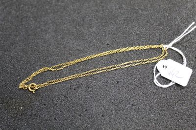 a close up of a gold chain with a key on it
