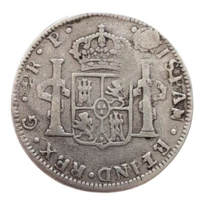 Gros plan sur une pièce de monnaie portant des armoiries