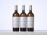 three bottles of wine sitting on top of a table next to each other