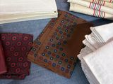 many different types of ties laid out on a table