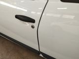 a close up of a white car with a black door handle