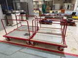 a red cart that is sitting in the middle of a room