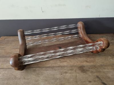 a wooden rack that has some glass on top of it