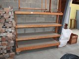 a pile of wood stacked on top of each other in a room