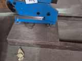 a blue machine that is sitting on the ground