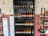 many bottles of beer on the shelves in the store