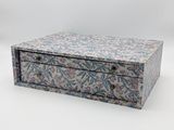 a small box with a floral pattern on it