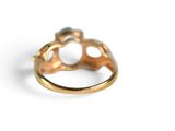 an image of a gold ring with a pearl in it