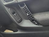 the interior of a car with the door open and the door handle missing