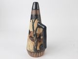 an image of a vase with a bird on it