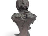an image of a bronze bust of a woman with a hood on