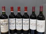 six bouteilles de vin alignées sur une table