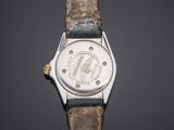 a close up of a wrist watch with a leather strap